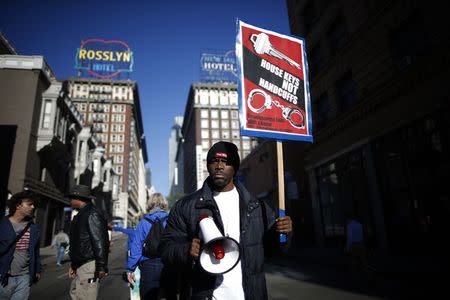 People protest against the killing of a homeless man by police in Los Angeles, California March 3, 2015. REUTERS/Lucy Nicholson