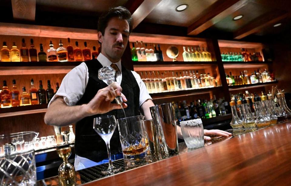 Bartender Sam Jackson creates a pair of carefully curated drinks at Bespoke, the new cocktail bar opened by Carmen Serrato and Po Tsai on Fulton Street in Fresno’s Brewery District. The bar, open for reservations only, offers a special unique approach to cocktails. Photographed Monday, June 26, 2023 in downtown Fresno.