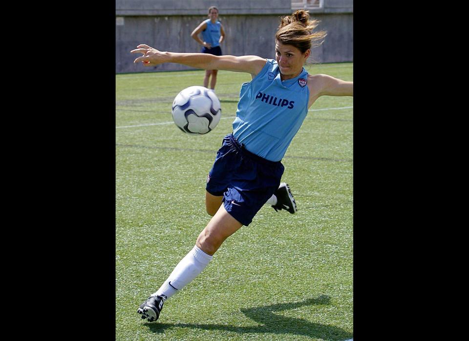 USA woman's soccer player Mia Hamm prepares to center the ball during a practice session at Rice Eccles Olympic Stadium 13 June 2003 in Salt Lake City, Utah. The US will play Ireland in a friendly match 14 June, 2003, in Salt Lake City. 