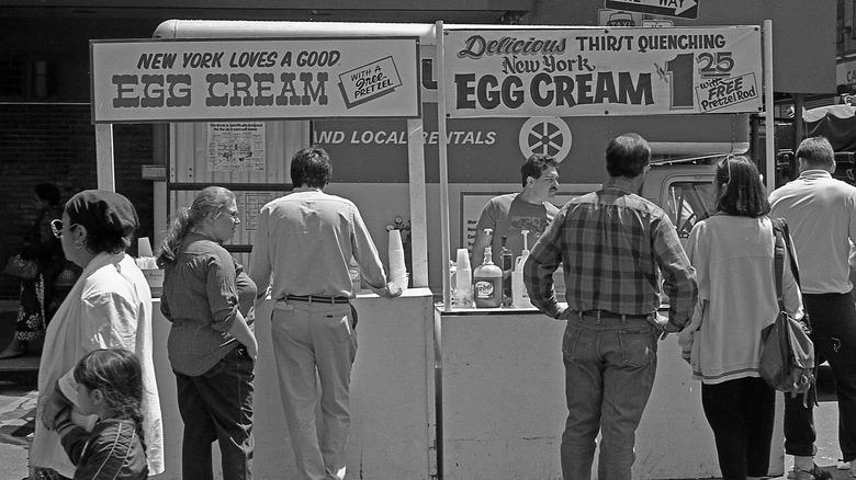 People waiting in line for egg creams