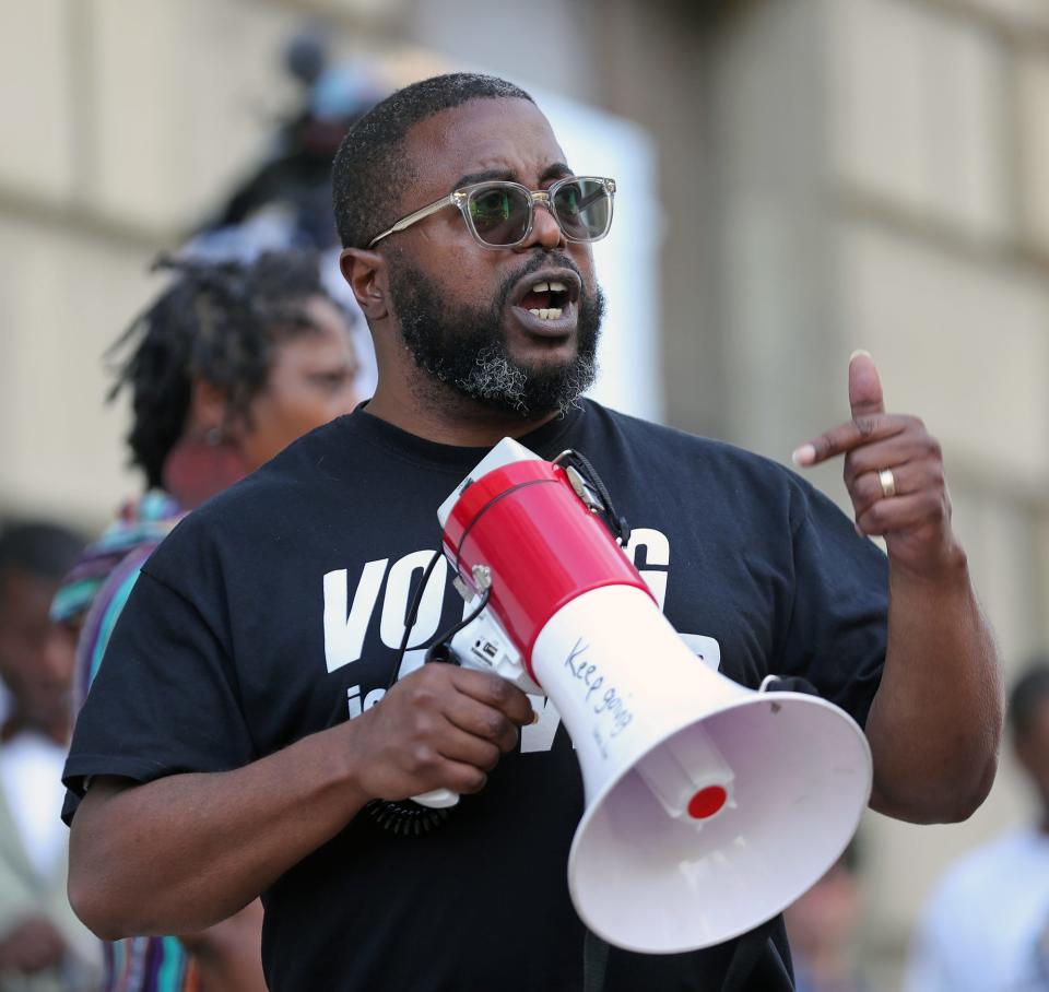 Ray Greene Jr. speaks during a rally outside Akron City Hall on Monday.