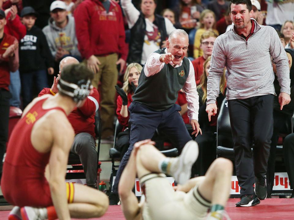 Iowa State coach Kevin Dresser celebrates after Zach Redding's victory at 133 pounds on Friday at Hilton Coliseum in Ames. Redding won by fall over Oklahoma's Wyatt Henson.