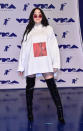 <p>Noah Cyrus goes casual in a white hoodie with thigh-high boots. (Photo: Getty Images) </p>