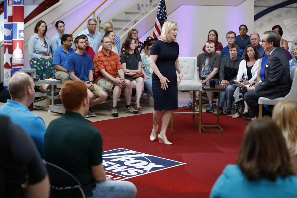 Democratic presidential candidate Sen. Kirsten Gillibrand talks with FOX News Anchor Chris Wallace, right, during a FOX News town hall, Sunday, June 2, 2019, in Dubuque, Iowa. (AP Photo/Charlie Neibergall)