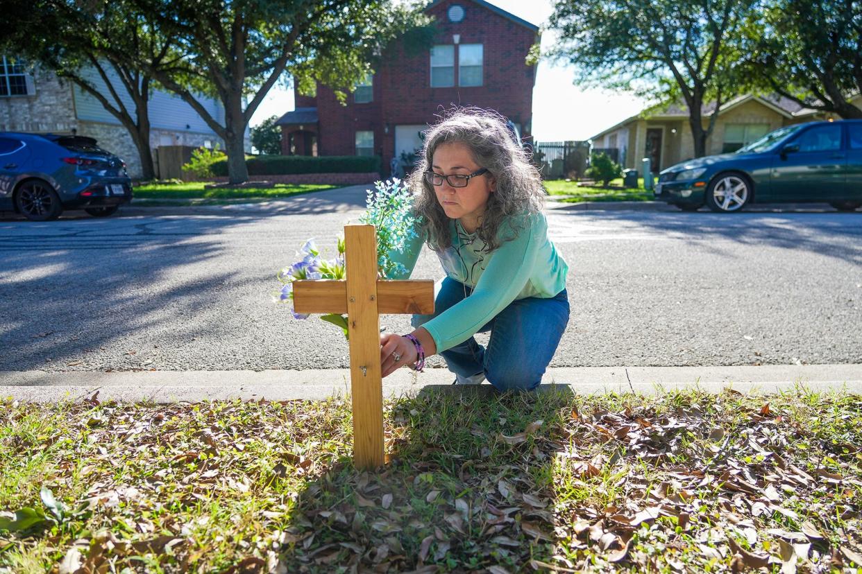 K. Lynn Samerigo's friends gathered to commemorate the one-year anniversary of the death of her husband by placing a cross outside her Pflugerville home. An autopsy report said John Samerigo died from improper treatment received from a medic.
