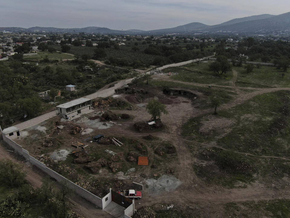 Construction of a private building project is seen on the outskirts of Teotihuacan, just north of Mexico City, Wednesday, May 26, 2021. The Mexican government said Tuesday that the project is destroying part of the outskirts of the pre-Hispanic ruin site and has repeatedly issued stop-work orders since March but the building crews have ignored them. (AP Photo/Fernando Llano)