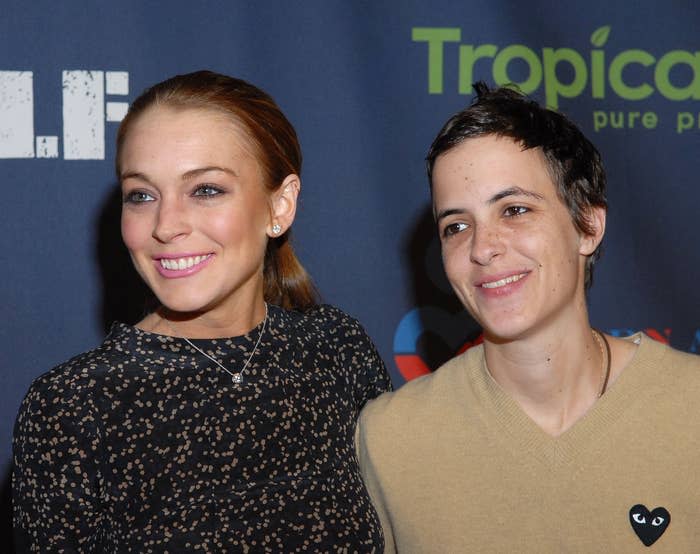 Lindsay Lohan and Samantha Ronson smiling at a media event