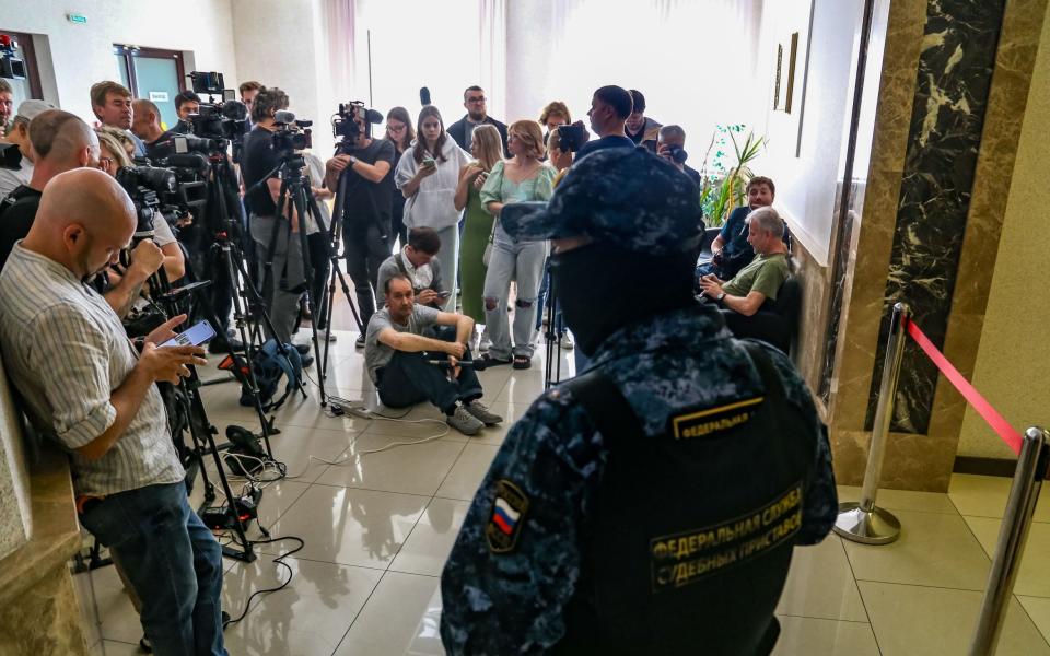 Crowds of journalists gather outside the closed-door hearing of Evan Gershkovich as a verdict is expected today