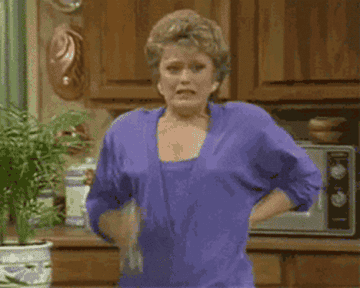 Blanche from "Golden Girls" spraying herself with water