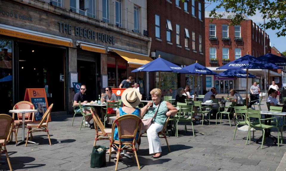 Customers enjoying the sunshine outside restaurants in St Albans.