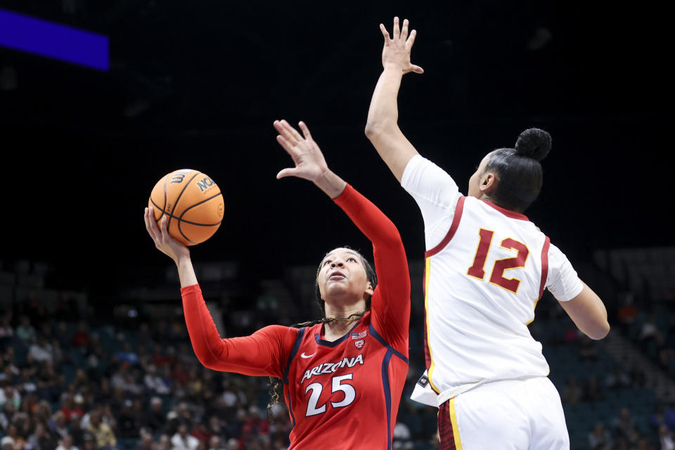 Arizona forward Breya Cunningham (25) shoots over Southern California guard JuJu Watkins (12) during the first half of an NCAA college basketball game in the quarterfinal round of the Pac-12 tournament Thursday, March 7, 2024, in Las Vegas. (AP Photo/Ian Maule)