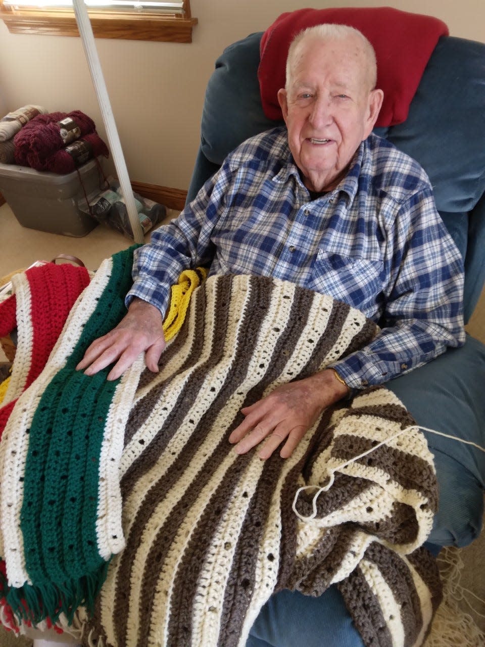 Bert Kohler, 91, of Dover has made about 500 scarves for free distribution by the Scarf Project.