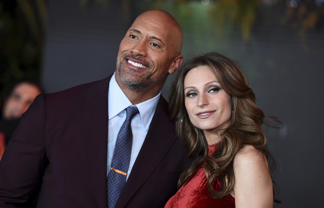 Lauren Hashian and Dwayne Johnson arrives at the Los Angeles premiere of "Jumanji: Welcome to the Jungle" on Monday, Dec. 11, 2017 in Hollywood, Calif. (Photo by Jordan Strauss/Invision/AP)