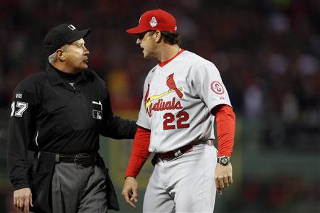 Oct 23, 2013; Boston, MA, USA; St. Louis Cardinals manager Mike Matheny (22) reacts after a call is overturned by umpire John Hirschbeck (17) during the first inning in game one of the MLB baseball World Series at Fenway Park. Greg M. Cooper-USA TODAY Sports