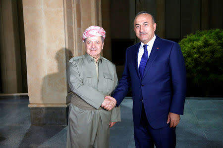 FILE PHOTO: Turkey's Foreign Minister Mevlut Cavusoglu meets with Iraq's Kurdistan region's President Massoud Barzani in Erbil, Iraq, August 23, 2017. REUTERS/Azad Lashkari