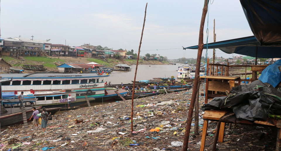 Litter covers the banks of a river in Peru.