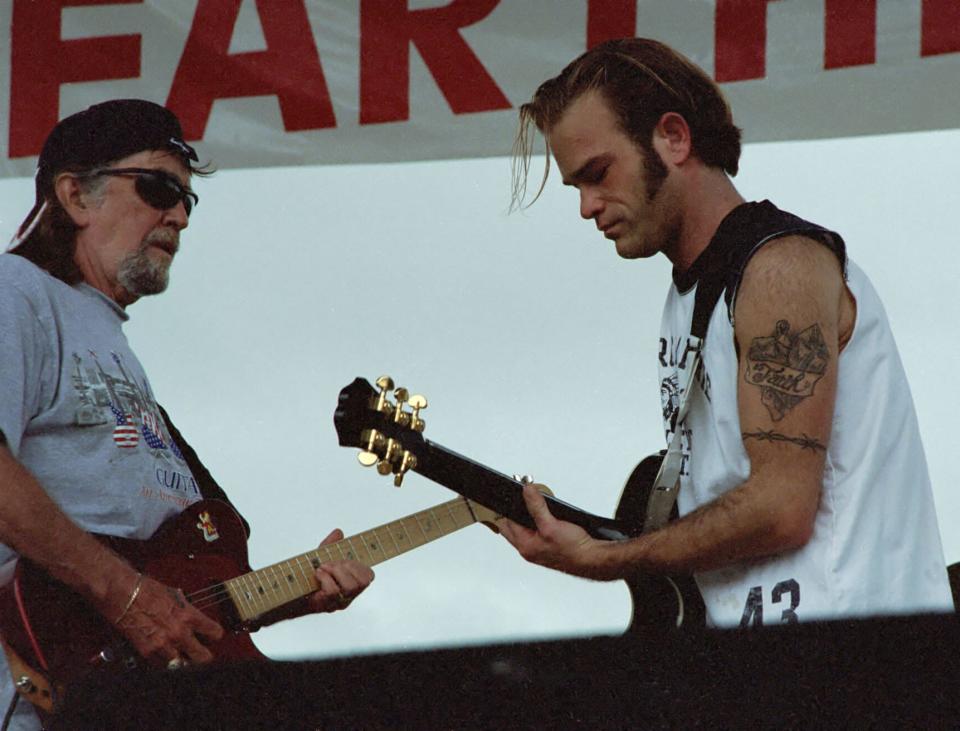 Nashville musician Waylon Payne (right) plays guitar with his dad Jody Payne during a benefit show with Willie Nelson in 2009.