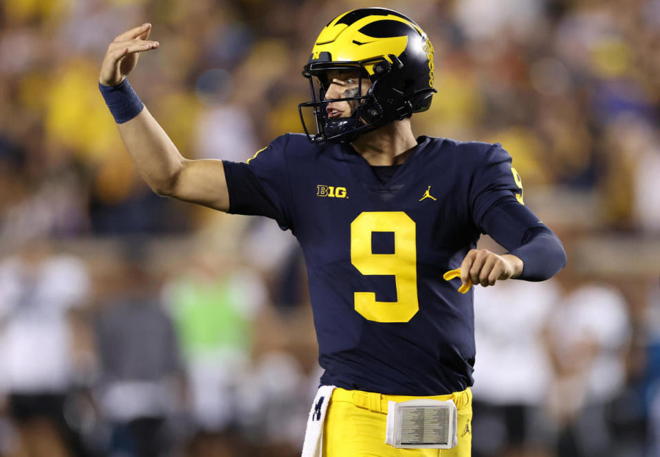 J.J. McCarthy #9 of the Michigan Wolverines signals the bench in the first half while playing the Hawaii Warriors at Michigan Stadium on September 10, 2022 in Ann Arbor, Michigan.  / Credit: Gregory Shamus/Getty Images