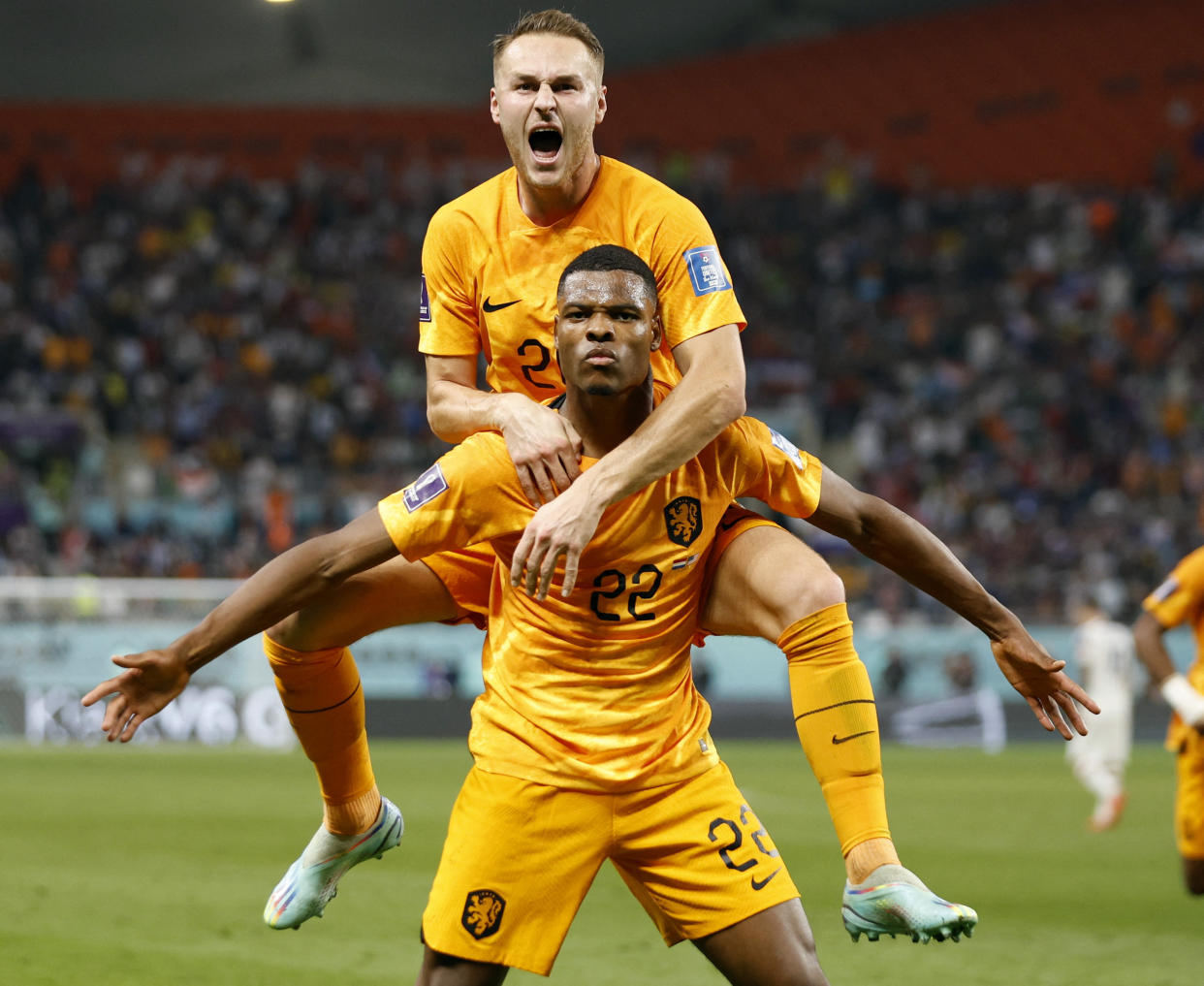 Soccer Football - FIFA World Cup Qatar 2022 - Round of 16 - Netherlands v United States - Khalifa International Stadium, Doha, Qatar - December 3, 2022 Netherlands' Denzel Dumfries celebrates scoring their third goal with Teun Koopmeiners REUTERS/John Sibley