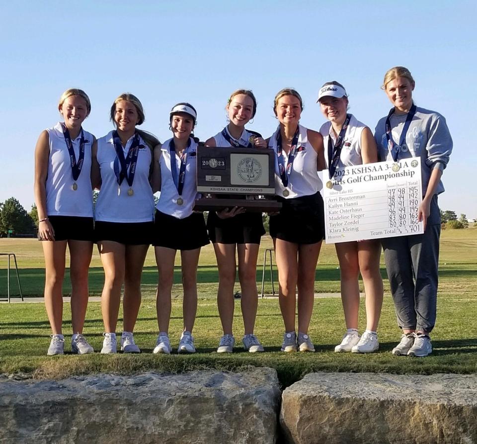 Silver Lake girls golf team with the state championship trophy on Tuesday, Oct. 17.
