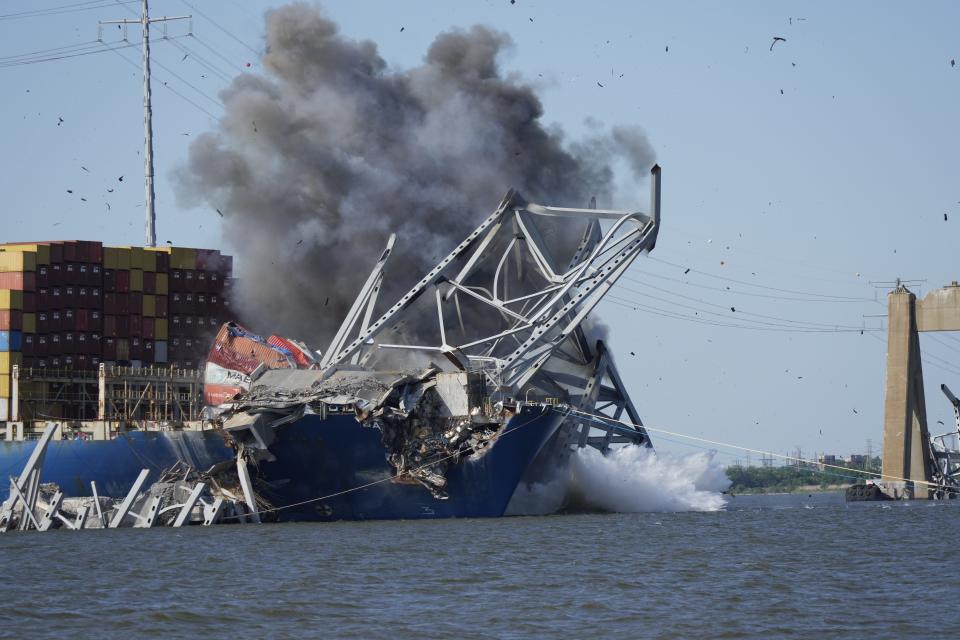 The Key Bridge Response Unified Command uses small explosives to remove steel girders of the Francis Scott Key Bridge wreckage resting on the deck of the M/V DALI container ship on May 13, 2024.
