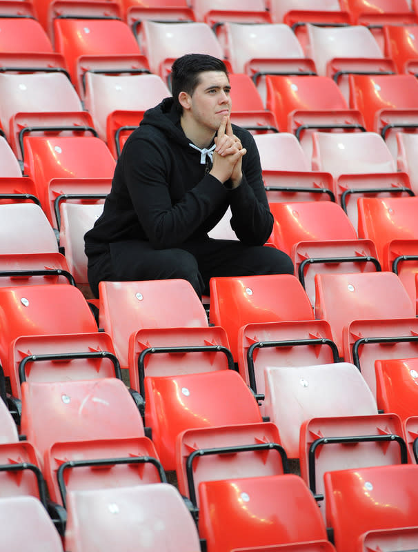 A Manchester United fan reacts after the English Premier League football match between Sunderland and Manchester United at The Stadium of Light in Sunderland, north-east England on May 13, 2012. AFP PHOTO/ANDREW YATES RESTRICTED TO EDITORIAL USE. No use with unauthorized audio, video, data, fixture lists, club/league logos or “live” services. Online in-match use limited to 45 images, no video emulation. No use in betting, games or single club/league/player publications.ANDREW YATES/AFP/GettyImages