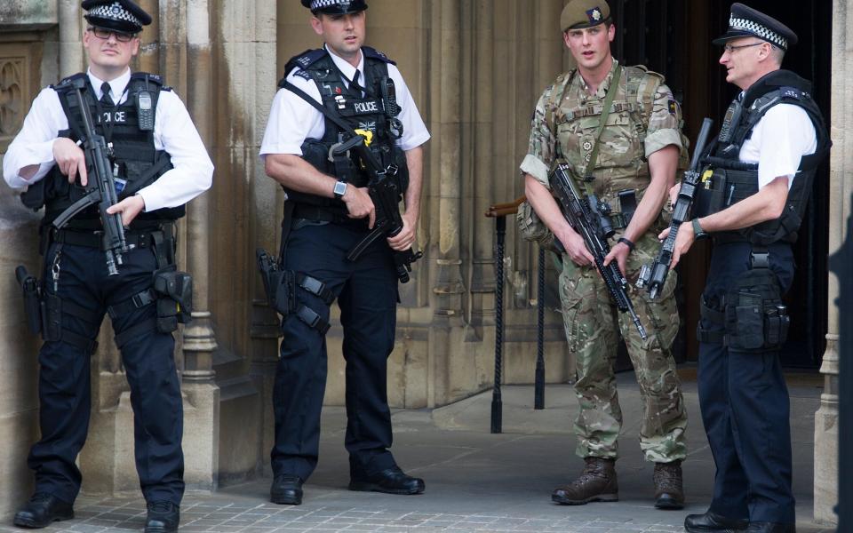 Soldiers and armed police on guard outside Parliament - Credit: Eddie Mulholland 