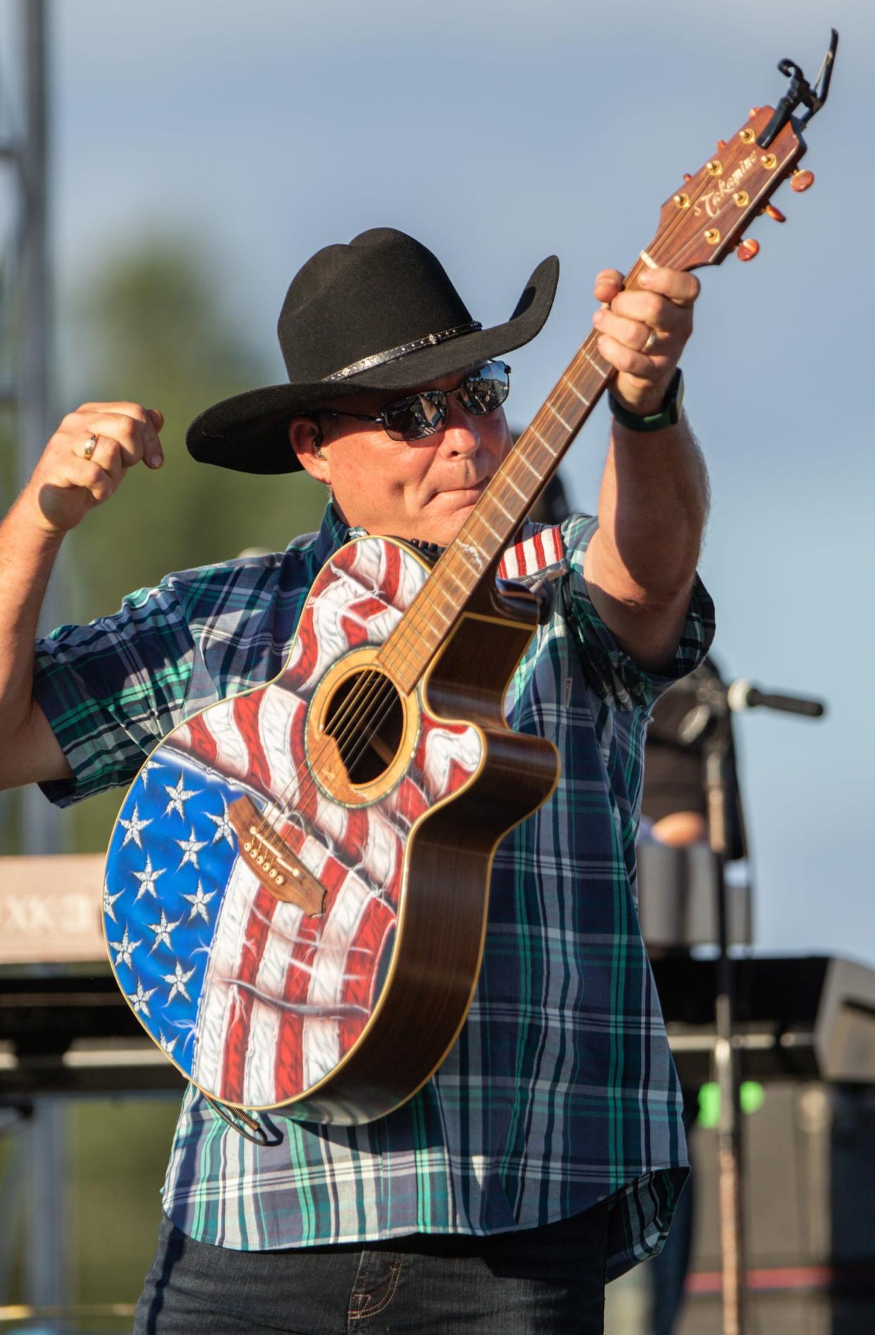 John Michael Montgomery gets his concert off to an energetic start at the Fowlerville Family Fair in Fowlerville, Michigan, July 30, 2022.