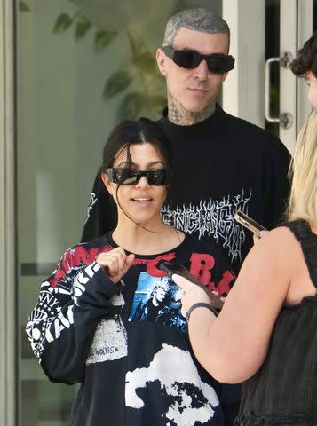 <p>BACKGRID</p> The couple chat with a few fans while out for lunch in Brisbane.