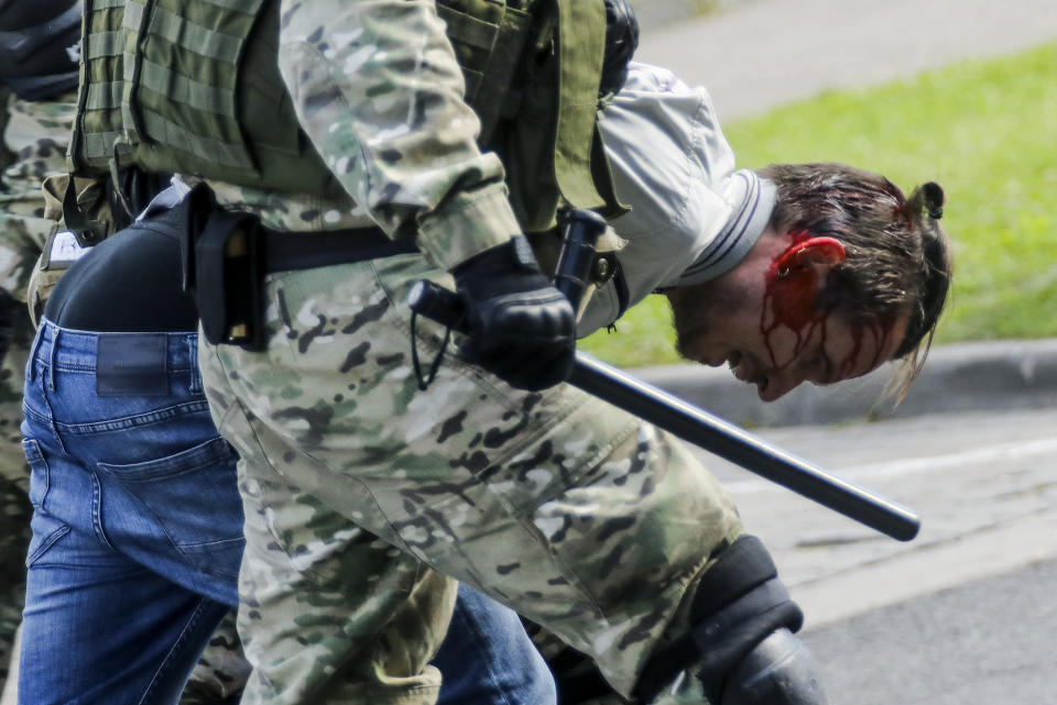 Riot police officers detain a protester during a Belarusian opposition supporters' rally protesting the official presidential election results in Minsk, Belarus, Sunday, Sept. 13, 2020. Protests calling for the Belarusian president's resignation have broken out daily since the Aug. 9 presidential election that officials say handed him a sixth term in office. (AP Photo)