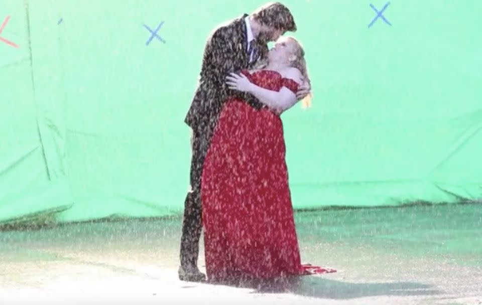 The co-stars were making out in the rain for a scene. Source: Splash News