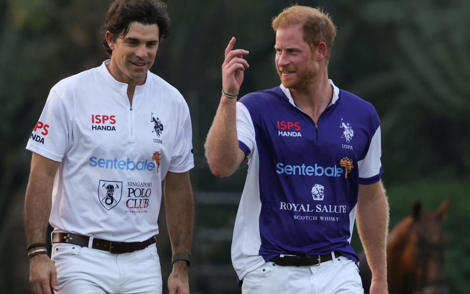 Prince Harry and Argentinian polo player Nacho Figueras at a charity polo match in Singapore yesterday