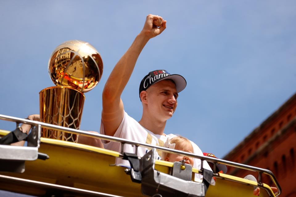 Denver Nuggets center Nikola Jokic gestures to the crowd during the championship parade after the Denver Nuggets won the 2023 NBA Finals.