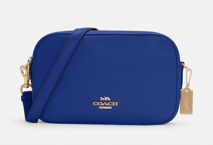 Jes Crossbody in cobalt blue with gold detailing (Photo via Coach Outlet)