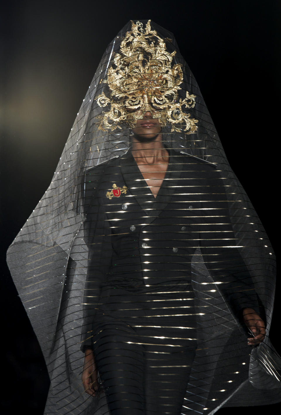 A model wears a design from the Philip Treacy Spring/Summer 2013 collection during London Fashion Week, Sunday, Sept. 16, 2012. (AP Photo/Jonathan Short)