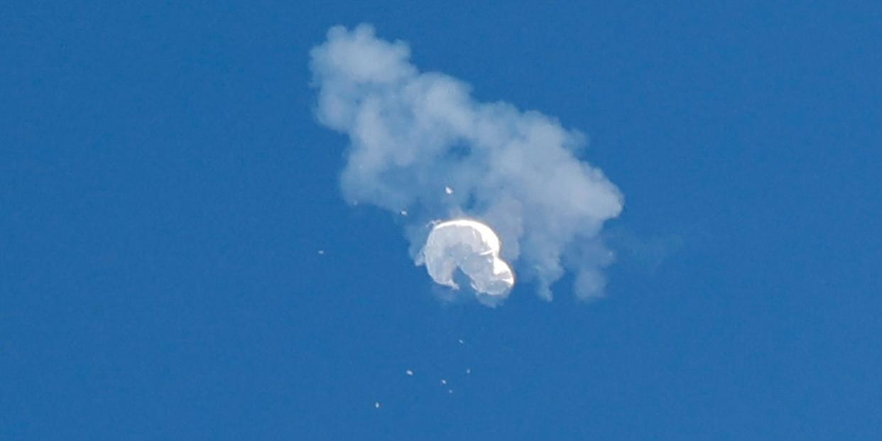 The suspected Chinese spy balloon drifts to the ocean after being shot down off the coast in Surfside Beach, South Carolina, U.S. February 4, 2023.
