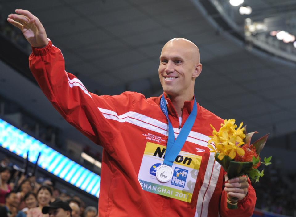 Canada's Brent Hayden smiles after he won silver in the final of the men's 100-metre freestyle swimming event in the FINA World Championships at the indoor stadium of the Oriental Sports Center in Shanghai on July 28, 2011. AFP PHOTO / PETER PARKS (Photo credit should read PETER PARKS/AFP/Getty Images)