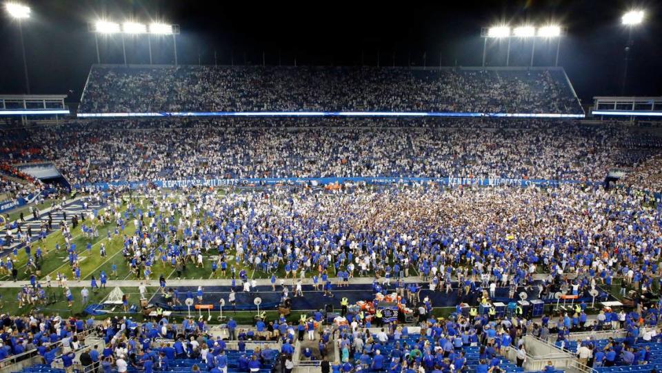 Kentucky fans storm the field after UK beat Florida at Kroger Field in 2021. It was first time since 1986 the Wildcats beat the Gators in Lexington.