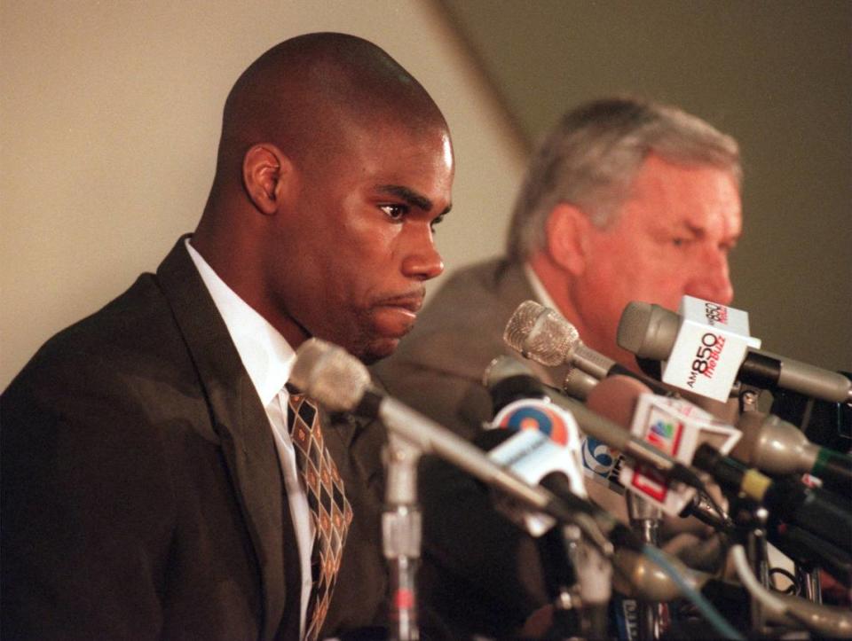 JAMISON5.SP.042798.JRR -- CHAPEL HILL, NC -- 4/27/98 -- Antawn Jamison faces the media along with Dean Smith during his press conference where he announced that he is leaving UNC to enter the NBA draft. STAFF PHOTO BY JOHN ROTTET STEVE ELLING STORY