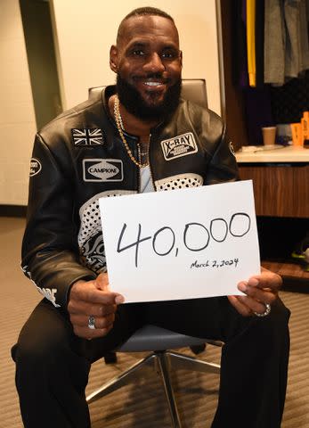 <p>Andrew D. Bernstein/NBAE via Getty Images</p> LeBron James celebrates his 40,000th point
