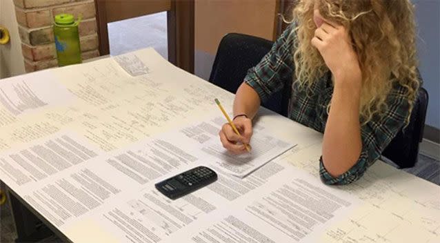 The teacher shared an image of the student and his large note card. Source: Reb Beatty/ Facebook