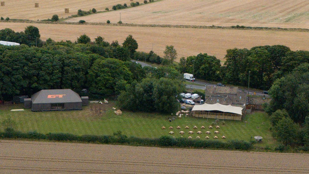 A marquee erected near to The Windmill pub (right) near Burford, Oxfordshire, which has been purchased by Jeremy Clarkson. (Getty)