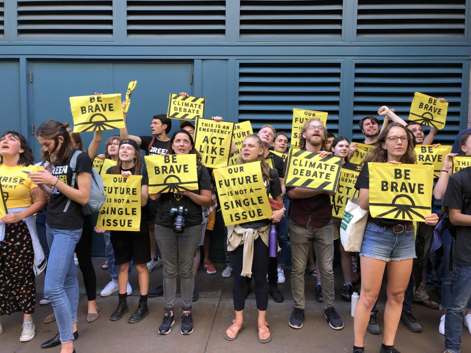 Sunrise Movement activists lobbied for a candidate debate focused solely on climate change outside the DNC's meeting Friday in San Francisco. (Photo: Sarah Ruiz-Grossman/HuffPost )