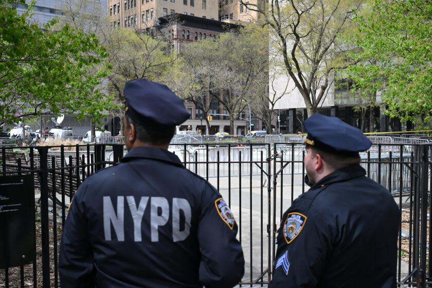 TOPSHOT - New York police guard the site across from Manhattan Criminal Court in New York City after a man reportedly set himself on fire during the trial of US President Donald Trump, in New York City on April 19, 2024. A man set himself on fire Friday outside the court, New York police said, with officers rushing to extinguish the flames. TV reporters described the scene that unfolded moments after the full panel of 12 jurors and six alternates was selected for the trial of the former president in a hush money cover-up case. (Photo by ANGELA WEISS / AFP) (Photo by ANGELA WEISS/AFP via Getty Images)