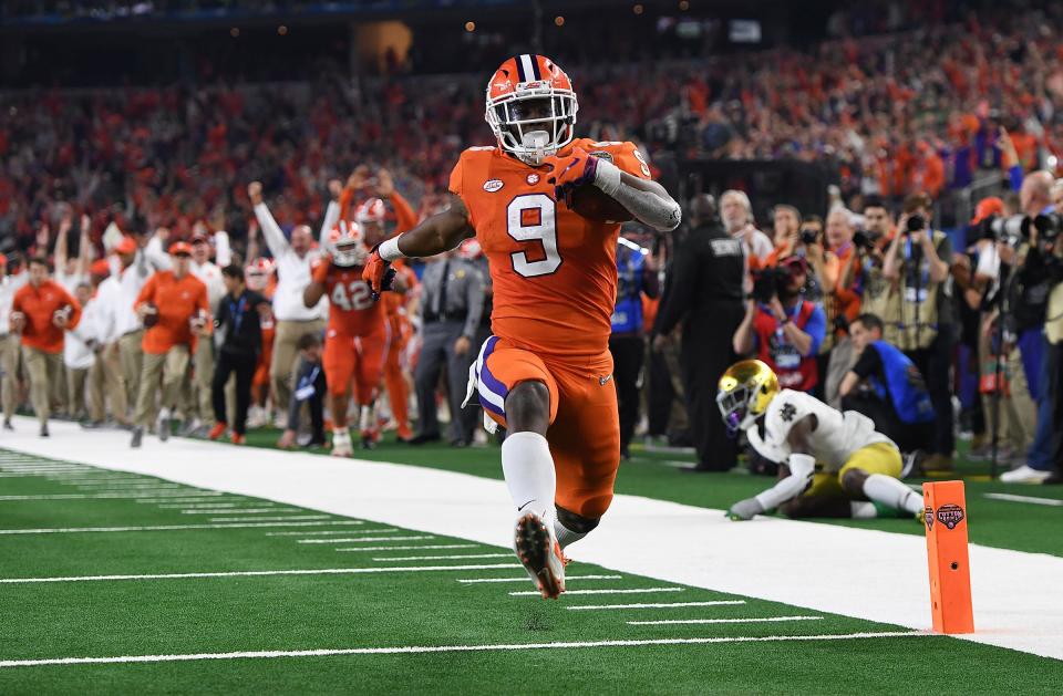 Clemson running back Travis Etienne (9) high steps it into the end zone on a 62 yard TD carry against Notre Dame during the 3rd quarter of the Goodyear Cotton Bowl at AT&T stadium in Arlington, TX Saturday, December 29, 2018.<br>Clemson Notre Dame Goodyear Cotton Bowl