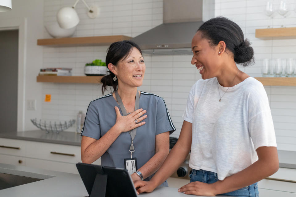 Nurse visiting patient at home