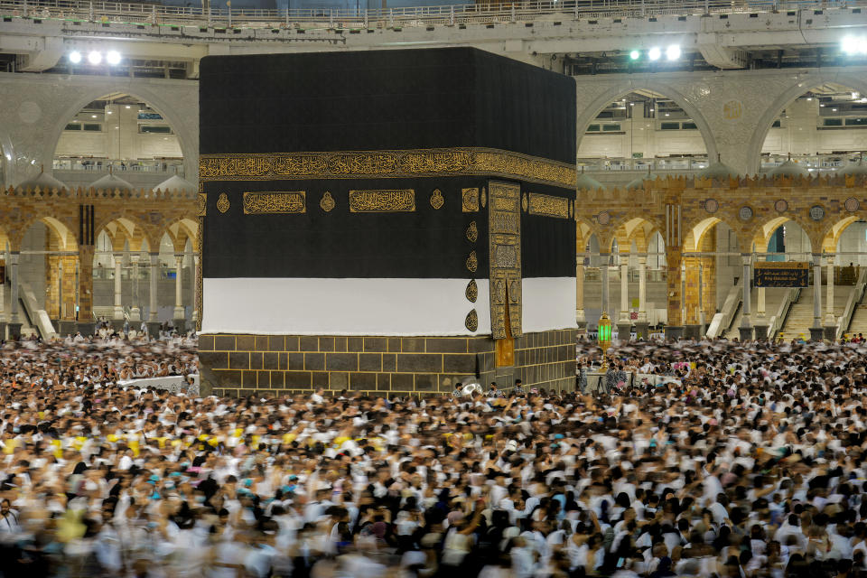 In this photo taken with low shutter speed, Muslim pilgrims circumambulate around the Kaaba, the cubic building at the Grand Mosque, in Mecca, Saudi Arabia, Wednesday, July 6, 2022. Muslim pilgrims are converging on Saudi Arabia's holy city of Mecca for the largest hajj since the coronavirus pandemic severely curtailed access to one of Islam's five pillars. (AP Photo/Amr Nabil)