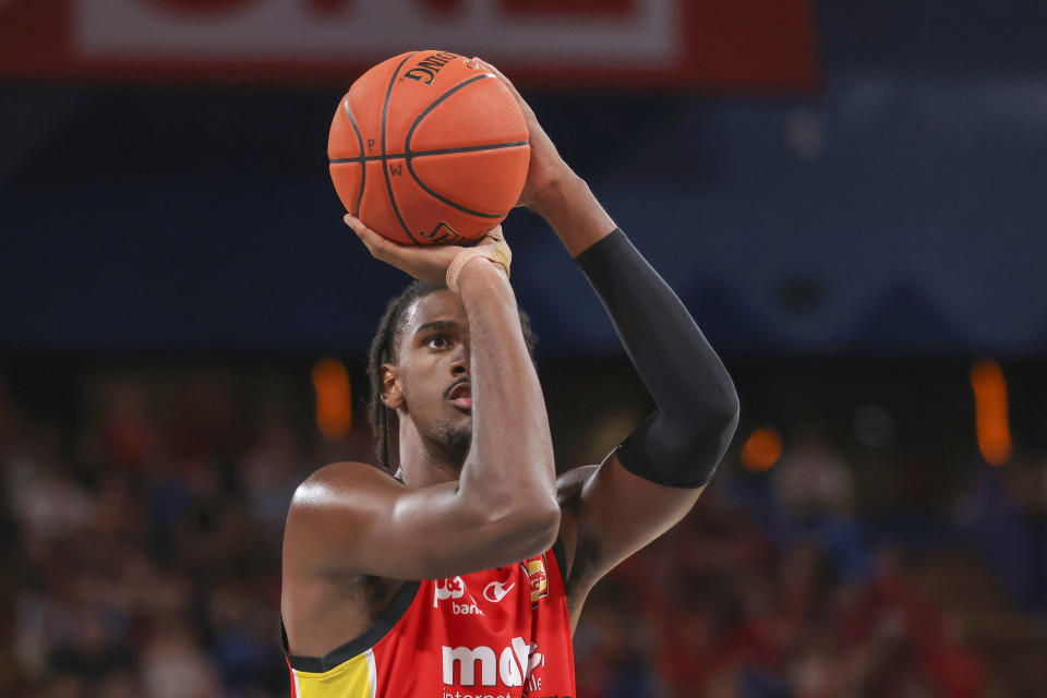 France's Alexandre Sarr of the Wildcats takes a free throw against the Cairns Taipans during a basketball game in Perth, Australia, Saturday, Feb. 10, 2024. This year's NBA draft may be one of the weakest in years, with no clear-cut choice at No. 1 and an overall lack of depth. What it will likely have again this year: a French connection at the top. A year after San Antonio selected Victor Wembanyama with the No. 1 pick, fellow Frenchmen Sarr and Zaccharie Risacher could go 1-2 in the June 26 draft. (Richard Wainwright/AAP Image via AP)