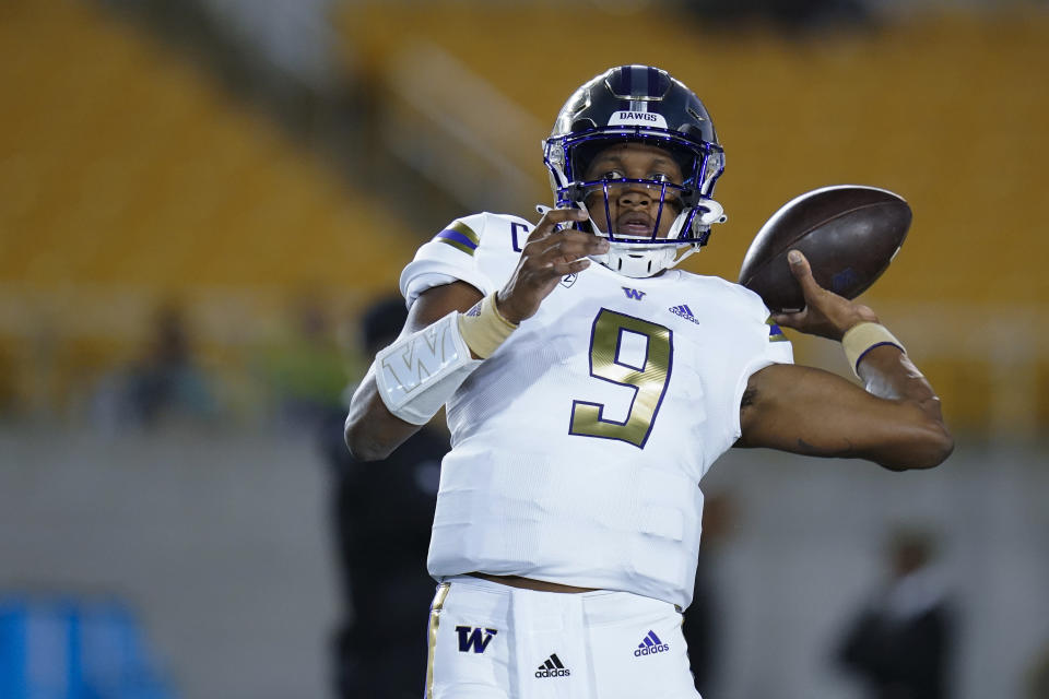 Washington quarterback Michael Penix Jr. warms up for the team's NCAA college football game against California in Berkeley, Calif., Saturday, Oct. 22, 2022. (AP Photo/Godofredo A. Vásquez)