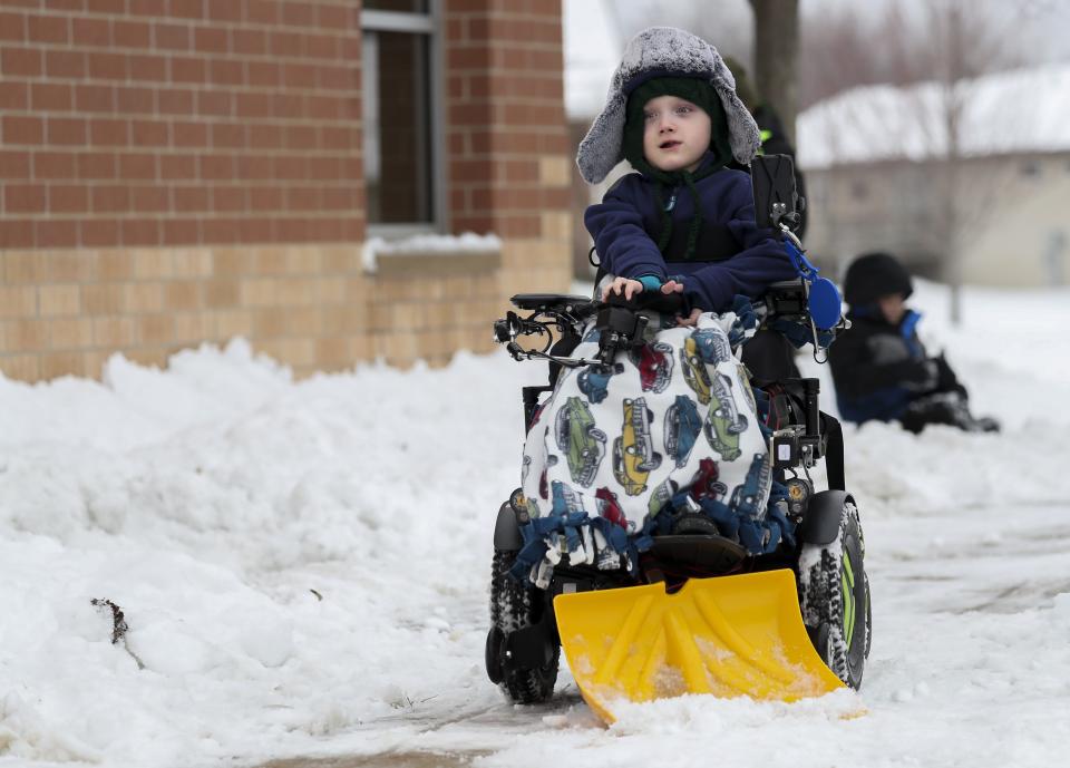First-grader Nolan Ferguson plows snow away from the sidewalk during recess on Tuesday, January 23, 2024, at Bay Harbor Elementary School in Suamico, Wis. Bay Harbor principal Tony Ebeling fashioned a makeshift snowplow that can be attached to Ferguson's wheelchair to give him another way to enjoy recess during the winter months.
Tork Mason/USA TODAY NETWORK-Wisconsin